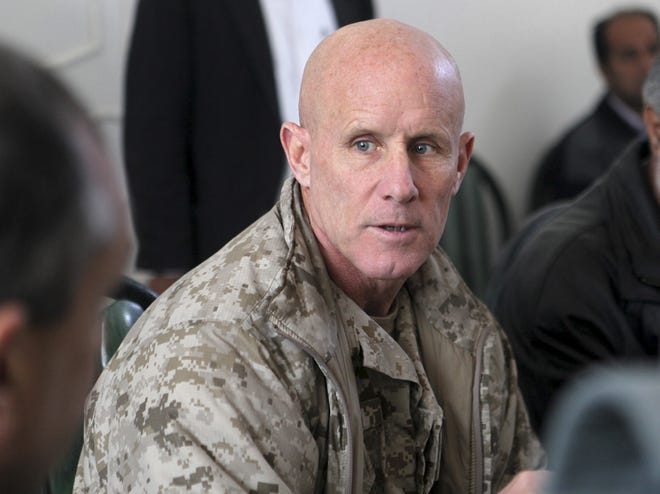 In this image provided by the U.S. Marine Corps, Vice Adm. Robert S. Harward, commanding officer of Combined Joint Interagency Task Force 435, speaks to an Afghan official during his visit to Zaranj, Afghanistan, Jan 6, 2011. Harward has turned down an offer to be President Donald Trump's new national security adviser, the latest blow to a new administration struggling to find its footing. A senior White House official said Feb. 16, 2017, that Harward had turned the offer down due to financial and family commitments. THE ASSOCIATED PRESS
