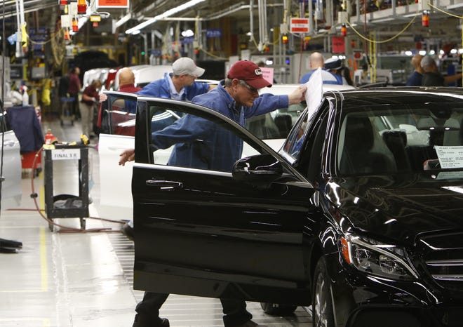 Workers at the Tuscaloosa County Mercedes-Benz plant on Tuesday conduct assembly and quality control work on the 2017 C Class automobiles. According to the Alabama Department of Commerce, exports of Alabama-made transportation products, including automobiles. climbed 15 percent in 2016 to nearly $10.7 billion.

[Staff photo/Gary Cosby Jr.]