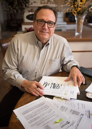 Don George, of Northampton, has spent many hours learning about the Pennsylvania Right-to-Know Law and exercising his right to get public information from government agencies. George shows a stack of attorney invoices he received in response to a request he made for property sales documents from his township.