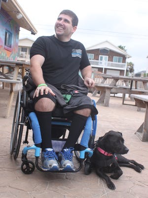 Stephen Watkins, a member of the Flagler County Sheriff’s Office, has received a companion in Mya, a 4-year-old lab-pit bull mix, training to become his service dog.