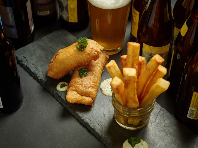 This fish and chips dish is from a recipe by the Culinary Institute of America. (Phil Mansfield/The Culinary Institute of America via AP)