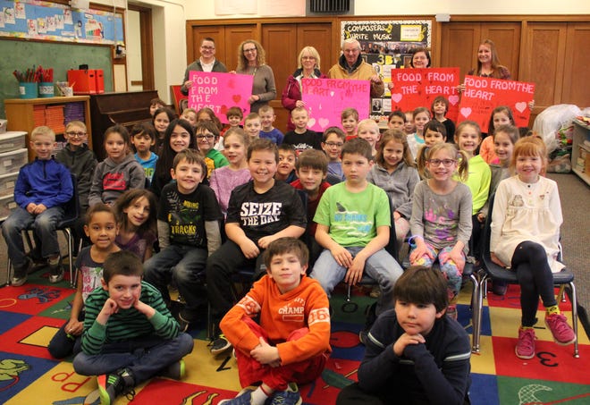 Second-grade students in Amy Seibold and Lori Lamphere's classes raised over $300 selling candy grams and collected over 300 canned food items to be donated to the Zion Community Food Pantry. [DARCY MEADE/IONIA SENTINEL-STANDARD]