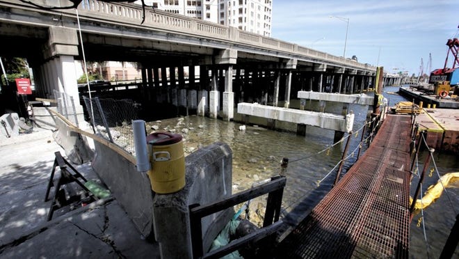 As crews began demolishing parts of the Flagler Memorial Bridge in 2014, some of the material removed was taken off-shore of Palm Beach to be used in an artificial reef. (Lannis Waters / The Palm Beach Post)