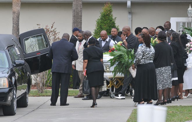 Family and friends of Rubye Harrison James leave after a service on Saturday at Mount Calvary Missionary Baptist Church in Leesburg. The 92-year-old retired school teacher was murdered last week. [TOM BENITEZ / CORRESPONDENT]