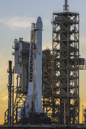 This photo provided by NASA shows a Space X Falcon9 rocket on the launch pad on Saturday. [NASA via ASSOCIATED PRESS]