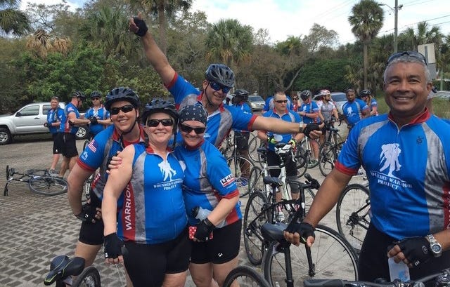 Veterans cheese it up during the 2016 Wounded Warrior Project Soldier Ride in Tampa. [AP FILE]