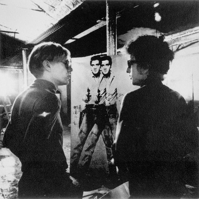 Nat Finkelstein’s “Andy, Bobby and Elvis” (photograph, 1965) on display at Willis Smith Gallery at Ringling College of Art and Design. Warhol gave the “Double Elvis” silkscreen print to Bob Dylan, who later traded it for a sofa to his manager Albert Grossman. He came to regret his decision. [Provided by RCAD]