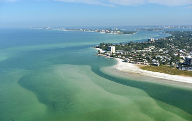 Aerial photo taken in Oct. 2012 showing Lido Key in the background, Big Pass linking Sarasota Bay to the Gulf, and Siesta Key south of Big Pass. The view is from the south, looking north. The Big Pass sand shoal at the mouth of the pass has been identifed as a sand source for Lido's beach renourishment project. [HERALD-TRIBUNE ARCHIVE / 2012]