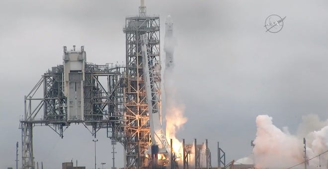 In this image from NASA TV, the SpaceX Falcon rocket launches from the Kennedy Space Center in Florida on Sunday. It's carrying a load of supplies for the International Space Station. [NASA TV via ASSOCIATED PRESS]