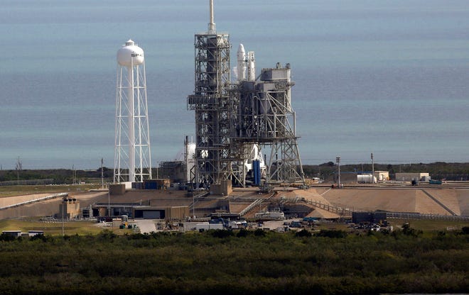 A Space X Falcon9 rocket sits on the launch pad Saturday at the Kennedy Space Center in Cape Canaveral. Last-minute rocket trouble forced SpaceX on Saturday to delay its inaugural launch from NASA’s historic moon pad, but the spacecraft launched successfully Sunday. (Red Huber/Orlando Sentinel via AP)