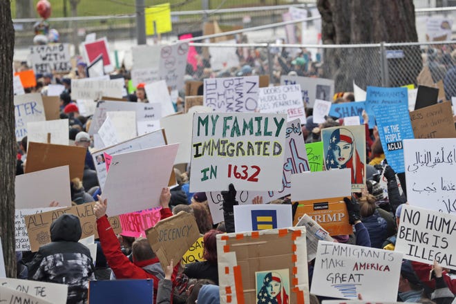 In this Jan. 28 file photo, protesters carry signs and chant in Lafayette Park near the White House in Washington during a demonstration to denounce President Donald Trump's executive order that bars citizens of seven predominantly Muslim-majority countries from entering the U.S. The number of anti-Muslim hate groups in the U.S. is exploding behind well-paid ideologues, radical Islamic attacks and the incendiary rhetoric of last yearís presidential campaign, the Southern Poverty Law Center said Wednesday in a new report. [AP Photo/Alex Brandon, File]