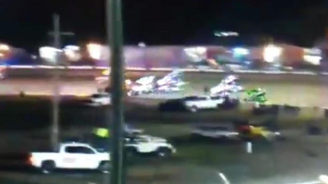 A screen grab from a video on Twitter of a car flipping into the stands Sunday night at Volusia Speedway. The video has been removed from Twitter. [Matt DeZwarte via Twitter]