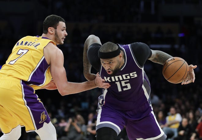 Sacramento Kings' DeMarcus Cousins, right, drives past Los Angeles Lakers' Larry Nance Jr. during the second half of a game on Feb. 14 in Los Angeles. The Kings have agreed to trade Cousins to the New Orleans Pelicans. [AP Photo / Jae C. Hong, File]