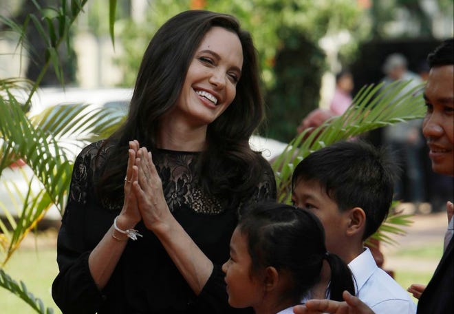 Hollywood actress Angelina Jolie smiles before a press conference in Siem Reap province, Cambodia, Saturday. Jolie on Saturday launches her two-day film screening of "First They Killed My Father" in Angkor complex in Siem Reap province. (AP Photo/Heng Sinith)