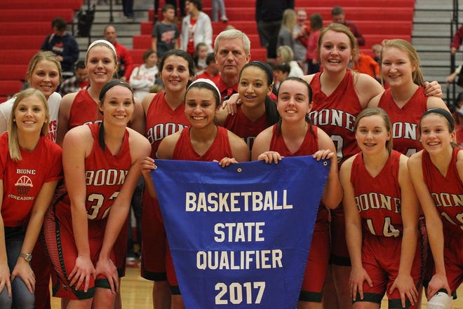 The 2017 Boone Toreadors holding the State Basketball qualifier banner.