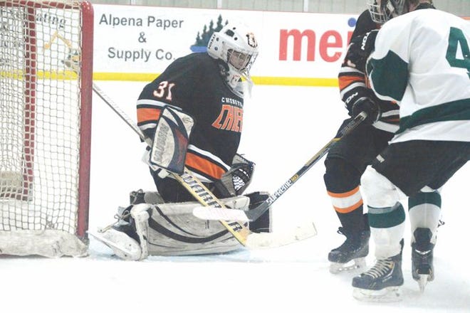 heboygan goaltender Carl Bartholomew III makes a save during a hockey game against Alpena at Northern Lights Arena on Tuesday.