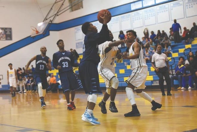 South Lenoir’s Roger Monroe goes up for two of his 25 points Tuesday as the Blue Devils defeated Wilson Beddingfield 73-68 in overtime.