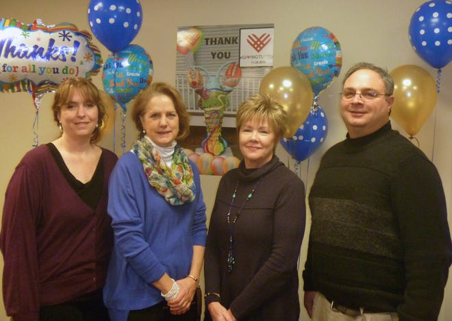OCES Board of Directors Development Committee thanks donors and supporters for their contributions during their #GivingTuesday campaign. (L to R), Paula Schlosser, Esq., West Bridgewater; Anna Seery, Director, Pembroke Council on Aging; Janice Fitzgerald, Director, Brockton Council on Aging; and Gene Mazzella, Director, Avon Council on Aging stand in front of a photo of Sid, OCES' #PlymouthLobsterCrawl creation, currently perched at the Spire Center in Plymouth.