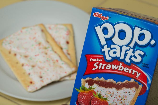 FILE - In this Monday, April 29, 2013, file photo, Kellogg’s brand Strawberry flavored Pop-Tarts are arranged for a photo in Surfside, Fla. Kellogg’s transformed its New York City restaurant into a Pop—Tarts Cafe for several days beginning Feb. 21, 2017. (AP Photo/Wilfredo Lee, File)