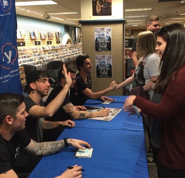 Lauren (top right) and her friend Molly meet the guys from All Time Low during a signing at (since-closed) FYE in Philadelphia in April 2015. Band members are (from top left) Jack Barakat, Rian Dawson, Alex Gaskarth and Zack Merrick.