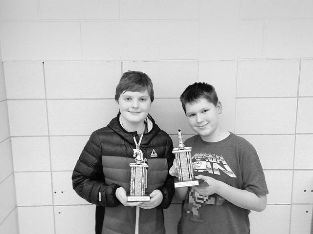 Trophies in the sixth- to eighth-grade division were awarded to Zachary Miller, right, first place, and Jack Rolfson, second place.