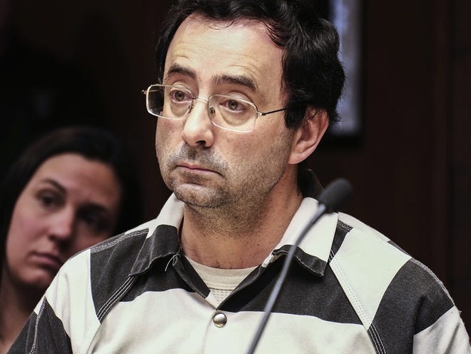 Dr. Larry Nassar listens to testimony of a witness during a preliminary hearing on Friday in Lansing, Mich. The former sports doctor at Michigan State University who specialized in treating gymnasts has been charged with sexual assault. [Robert Killips / Lansing State Journal via AP, File]