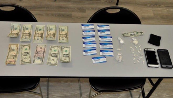 Raynham police posted on their Twitter account a picture of the items, drugs and money confiscated from Nicholas Bickel, of Taunton, on Sunday.