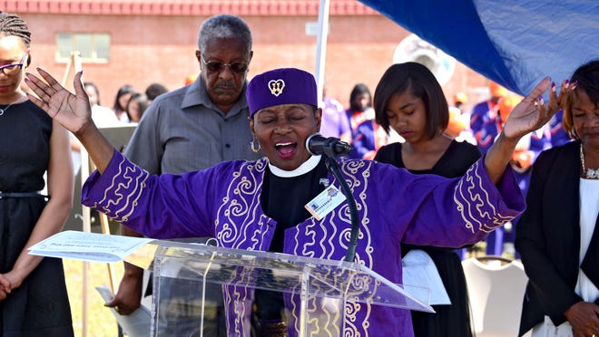 The Rev. D. Lovett Sconiers, chaplain at Edward Waters College, delivers the invocation at the start of the event. (Bob Mack/Florida Times-Union)