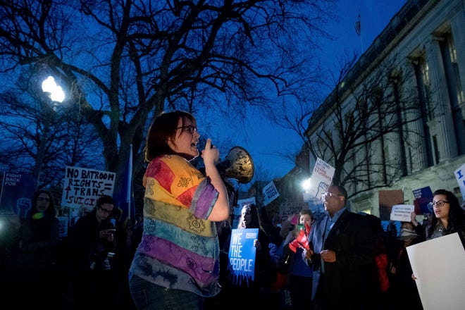 Activists and protesters with the National Center for Transgender Equality rally in front of the White House, Wednesday, Feb. 22, 2017, in Washington, after the Department of Education and the Justice Department announce plans to overturn the school guidance on protecting transgender students. (AP Photo/Andrew Harnik)
