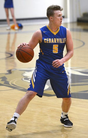 Cedarville's Justin Shelly brings the ball up the floor during a game against Charleston on Friday, Feb. 17, 2017, at Charleston. [BRIAN D. SANDERFORD/TIMES RECORD]