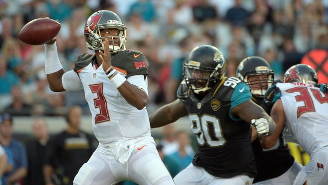 Tampa Bay Buccaneers quarterback Jameis Winston (3) throws a pass as he is pressured by Jaguars defensive tackle Malik Jackson (90) during the first half of a preseason football game Aug. 20 in Jacksonville. (Associated Press)