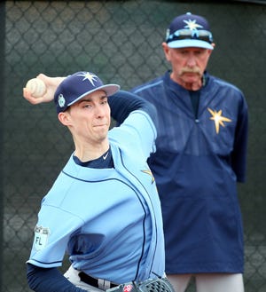 Blake Snell throws a bullpen session under the watchful eyes of pitching coordinator Dick Bosman at Rays spring training at the Charlote Sports Park complex in Port Charlotte. [HERALD-TRIBUNE STAFF PHOTO / DENNIS MAFFEZZOLI]