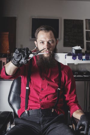 Seth Izzard, owner of Izzy'z Barbershop, is a character in Colleen Lance's newest book in the Elizabeth Guthrie Mystery series, titled "The Barber." [Alejandro Photography]