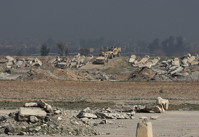 U.S. Army forces stage inside Mosul's international airport, in western Mosul, Iraq, Feb. 24, 2017. Iraqi forces pushed into the first neighborhood in western Mosul on Friday and took full control of the international airport on the city's southwestern edge from the Islamic State group, according to Iraqi officials. THE ASSOCIATED PRESS