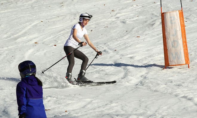 With temperatures close to 70 degrees, Maggie Pelligri, 14, of Milton, took to the hill at Blue Hills Ski Area in a tee shirt on Friday, Feb. 24, 2017.