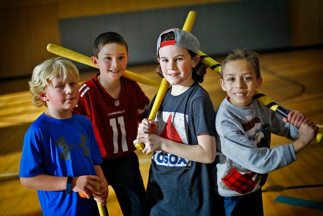 Members Caden Altobello, 7, Cooper Love, 7, Shea Brearley, 10 and Dominic Alphonse, 8, during a round of wiffle ball.