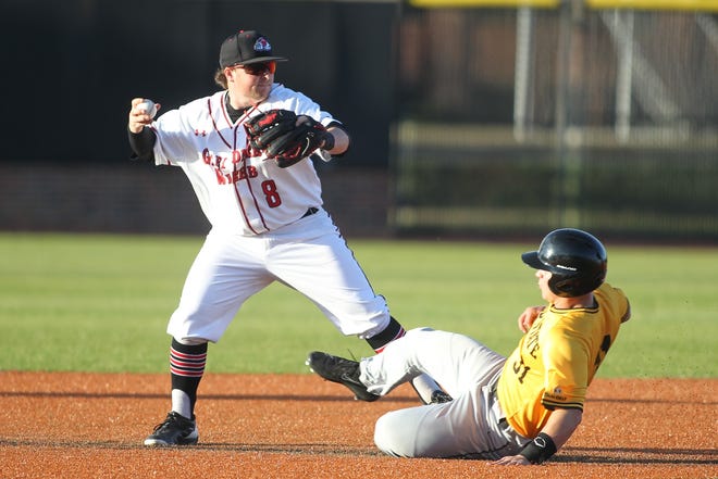 GWU's Collin Thacker makes a relay on to first base as Appalachian State's Caleb Grubbs slides into second Friday afternoon in Boiling Springs. [Hannah Dunaway/The Star]