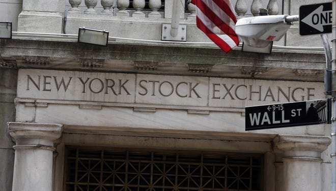 This Thursday, Oct. 2, 2014, file photo shows the Wall Street entrance of the New York Stock Exchange. THE ASSOCIATED PRESS