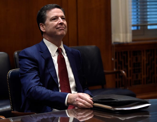 In this Feb. 9, 2017, file photo, FBI Director James Comey waits for the start of a meeting with Attorney General Jeff Session and the heads of federal law enforcement components at the Department of Justice in Washington. Comey is again in a familiar spot these days _ the middle of political tumult. As a high-ranking Justice Department official in the George W. Bush administration, he clashed with the White House over a secret surveillance program. Years later as head of the FBI, he incurred the ire of Hillary Clinton supporters for public statements on an investigation into her emails. Now, Comey is facing new political pressure as White House officials are encouraging him to follow their lead by publicly recounting private FBI conversations in an attempt to dispute reports about connections between the Trump administration and Russia. (AP Photo/Susan Walsh, Pool, File)