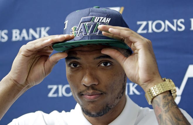 Utah Jazz 2016 draft pick Joel Bolomboy adjusts his hat during a media availability at the Vivint Smart Home Arena on June 29, 2016, in Salt Lake City. Bolomboy has been back and forth between the NBA Developmental League's Salt Lake City Stars and the Jazz 15 times since November [AP Photo / Rick Bowmer]