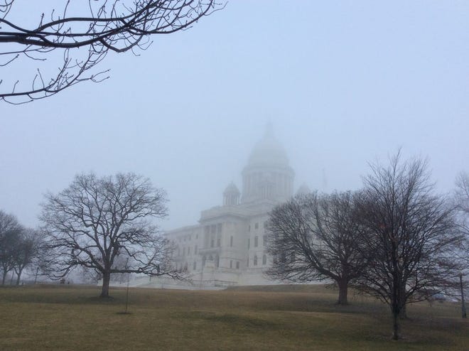 Fog shrouds the Rhode Island State House Saturday morning. The fog is expected to give way to clouds in the late morning, which will produce rain Saturday night, according to the National Weather Service.