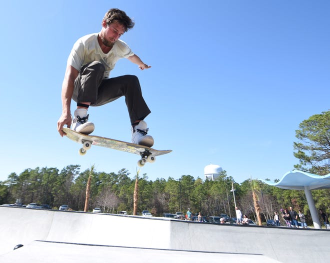 Dre Harper gets some air on the opening day of the 10,000-sq. foot addition at Ogden Skatepark in Wilmington, N.C. Saturday, February 25, 2017. Funding for the park came from New Hanover County, which earmarked $265,000 for the project; public donations; and a $25,000 from the Tony Hawk Foundation. [Matt Born/StarNews Photo]