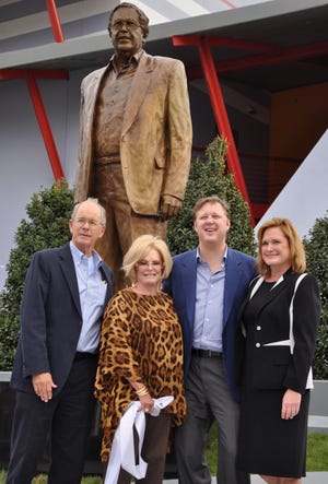 Jim France, left, along with the late Betty Jane France, Brian France and Lesa France Kennedy are seen at a ceremony celebrating an unveiling of statue honoring Bill France Jr. in 2012. Bill and Lesa are now the third generation in a family business that started 79 years ago. [NEWS-JOURNAL FILE]