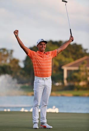 Rickie Fowler celebrates after winning the Honda Classic golf tournament, Sunday, Feb. 26, 2017, in Palm Beach Gardens, Fla. (AP Photo/Wilfredo Lee)