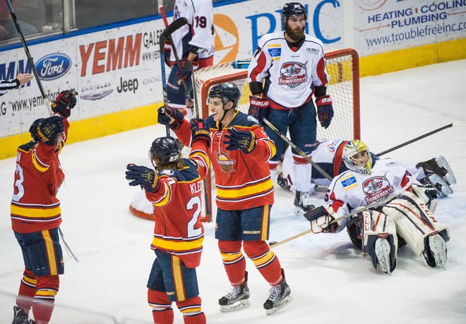 RYAN MICHALESKO/JOURNAL STAR The Rivermen celebrate a goal during their 7-2 win over the Evansville Thunderbolts on Sunday, Feb. 26, 2017, in Peoria.