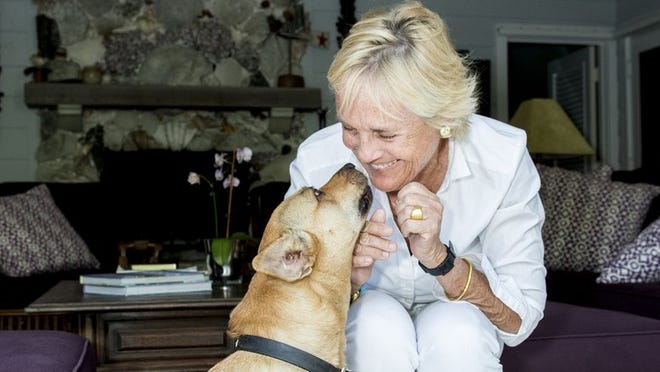 Liza Pulitzer with her dog Coco. The daughter of the iconic designer adopted the street dog from the Bahamas. Melanie Bell / Daily News