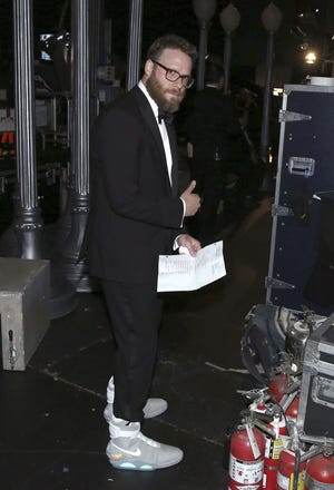 Seth Rogen sports his future boots backstage.
