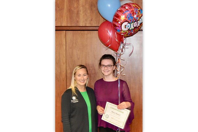 WASHINGTON BOUND — Macy Daniel, right, celebrates being selected to represent Randolph Electric Membership Corp. as the 2017 Youth Tour Delegate. Also pictured is Kathleen Duckworth, REMC Communication and Outreach specialist. (Contributed photo)