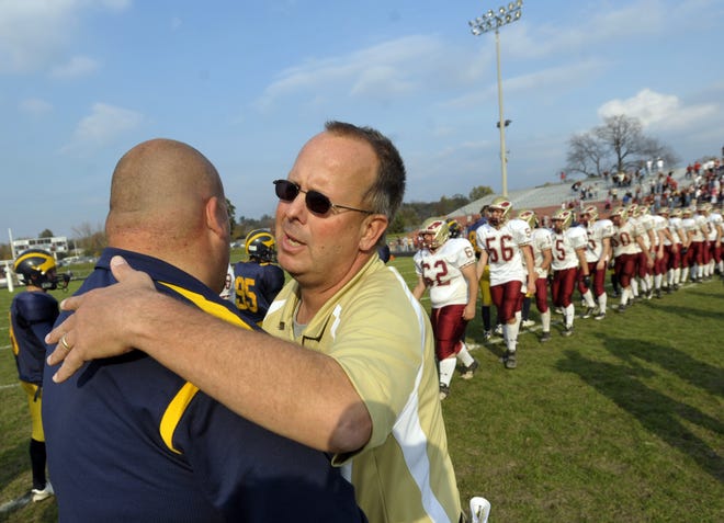 RON JOHNSON/JOURNAL STAR FILE PHOTO

Dunlap coach Jeff Alderman, right, and Woodruff coach Tim Thorton, left, congratulate each other after a playoff game in 2008.