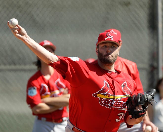 FILE - In this Feb. 17, 2017, file photo, St. Louis Cardinals starting pitcher Lance Lynn throws during a spring training baseball workout in Jupiter, Fla. Lynn takes the mound for the Cardinals for the first time since undergoing Tommy John surgery in 2015. After missing all of last season and entering a contract year, Lynn, a former All-Star, will be counted on to bring stability to the St. Louis rotation. (AP Photo/David J. Phillip, File)